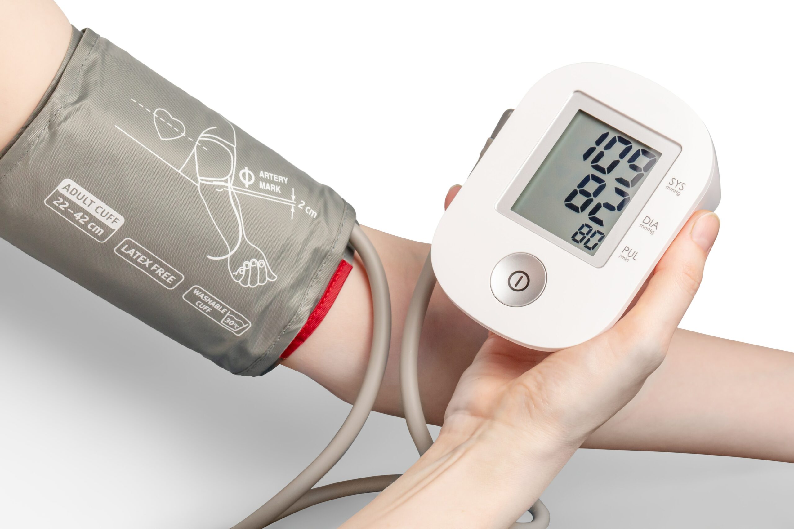 someone taking a blood pressure reading with a blood pressure cuff